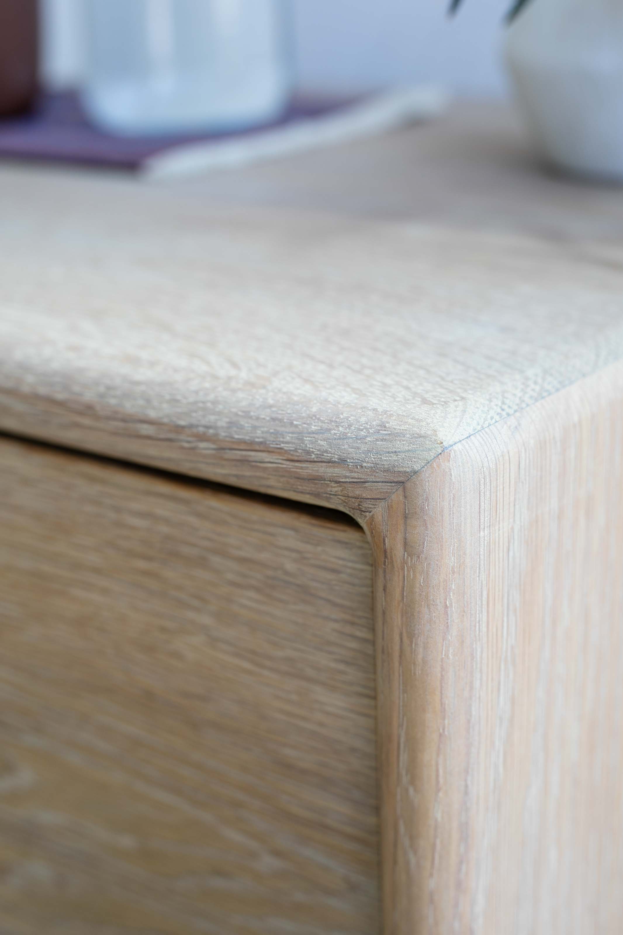 Close-up of the corner joinery on a Tavolo Studios solid white oak nightstand.