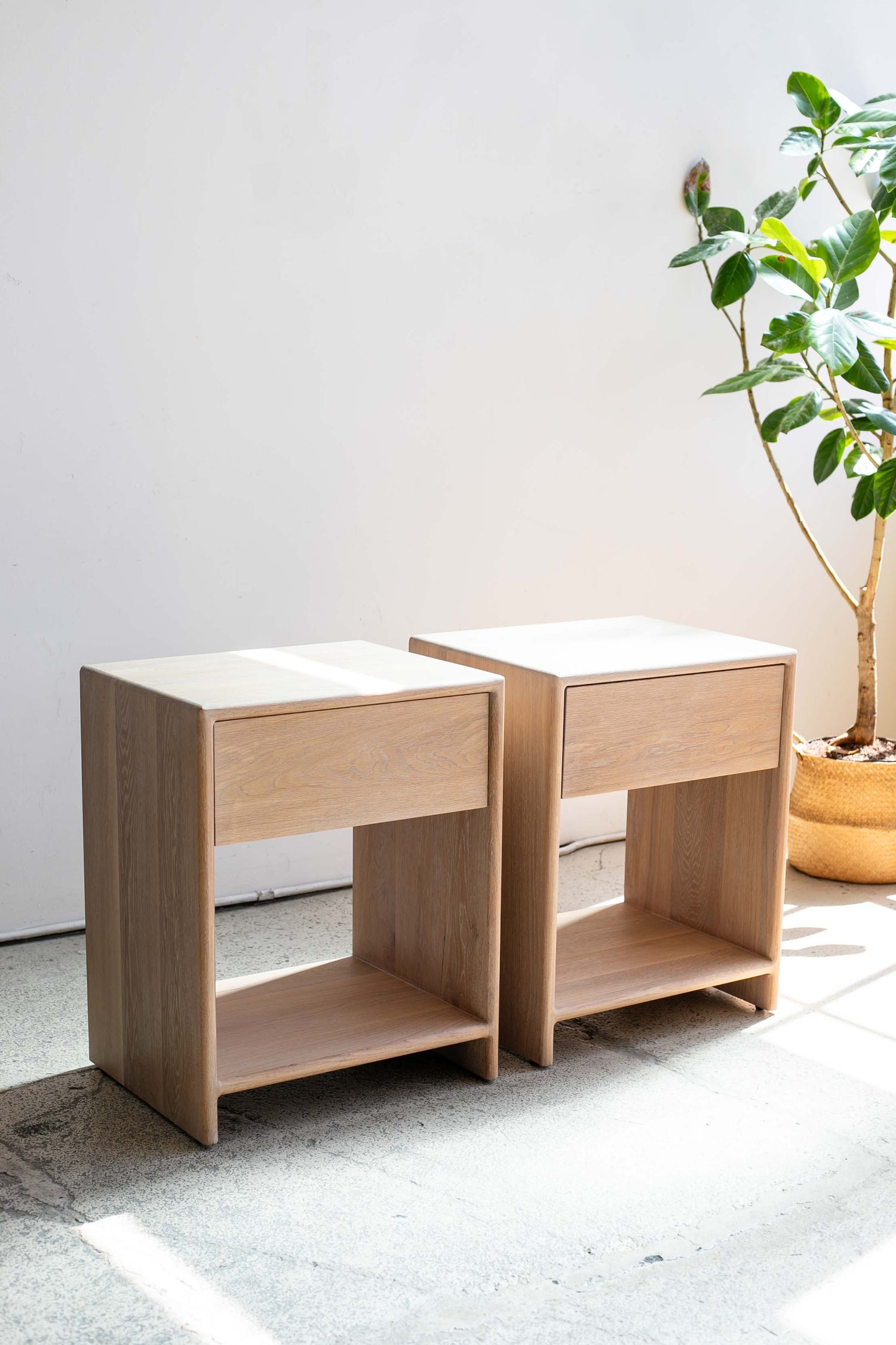 Pair of solid white oak nightstands standing side by side — completed Tavolo Studios commission.