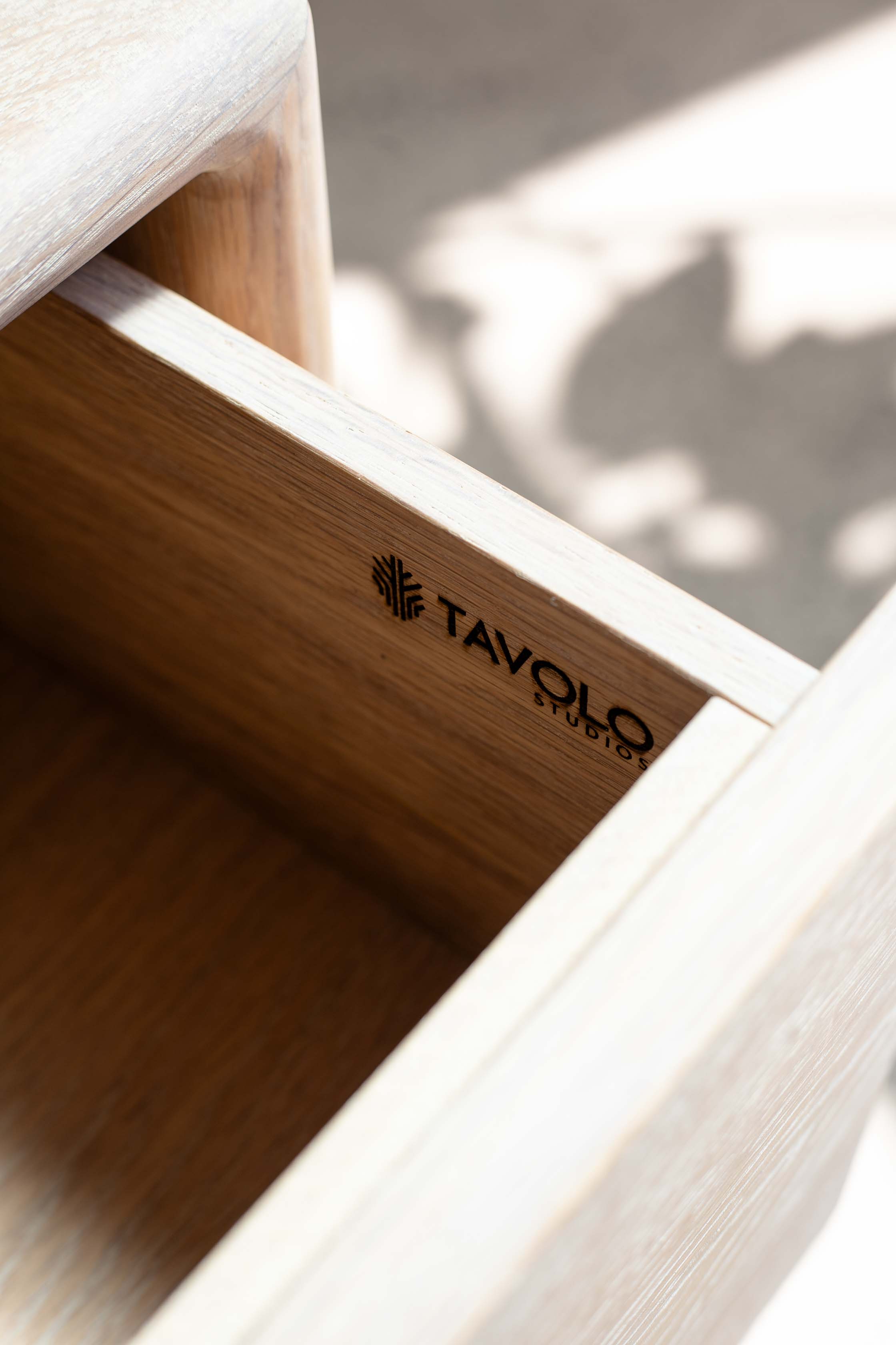 Tavolo Studios maker's mark burned inside the drawer of a solid white oak nightstand.